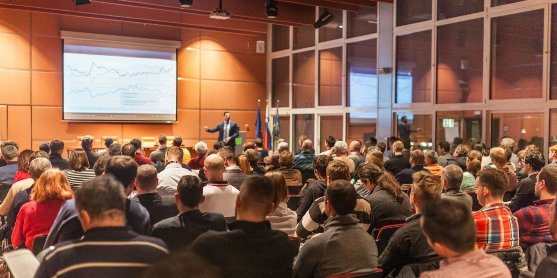 A large group of people in an auditorium.