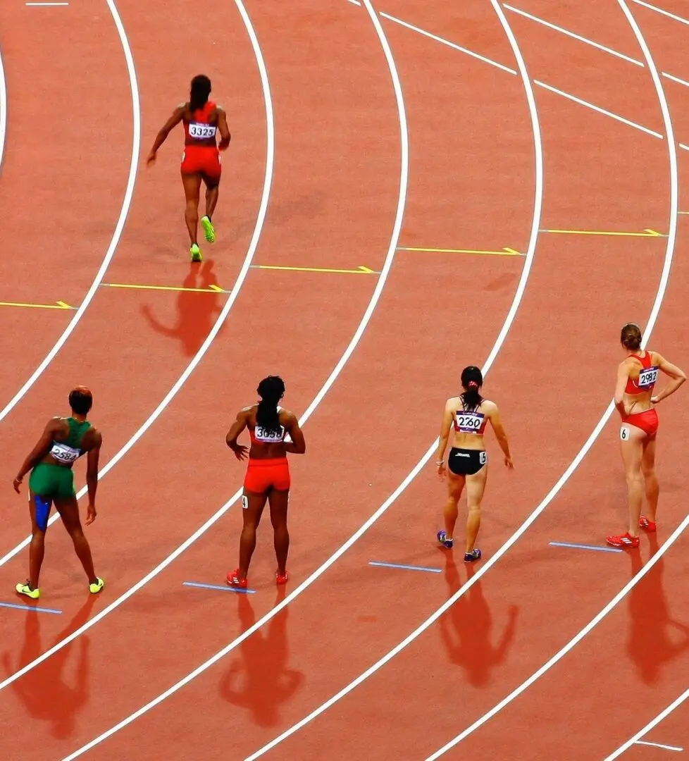 A group of people running on a track